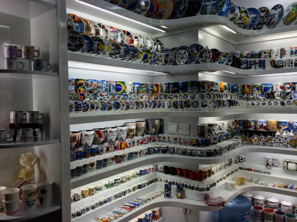Shelves of gift mugs and souvenir plates at Yiwu International Trade Mart in 2014